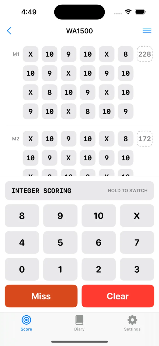 A WA1500 score card part way through on an iPhone, with the purpose-built score keyboard docked beneath it: Integer Scoring, keys for the rings and X, and Miss and Clear.